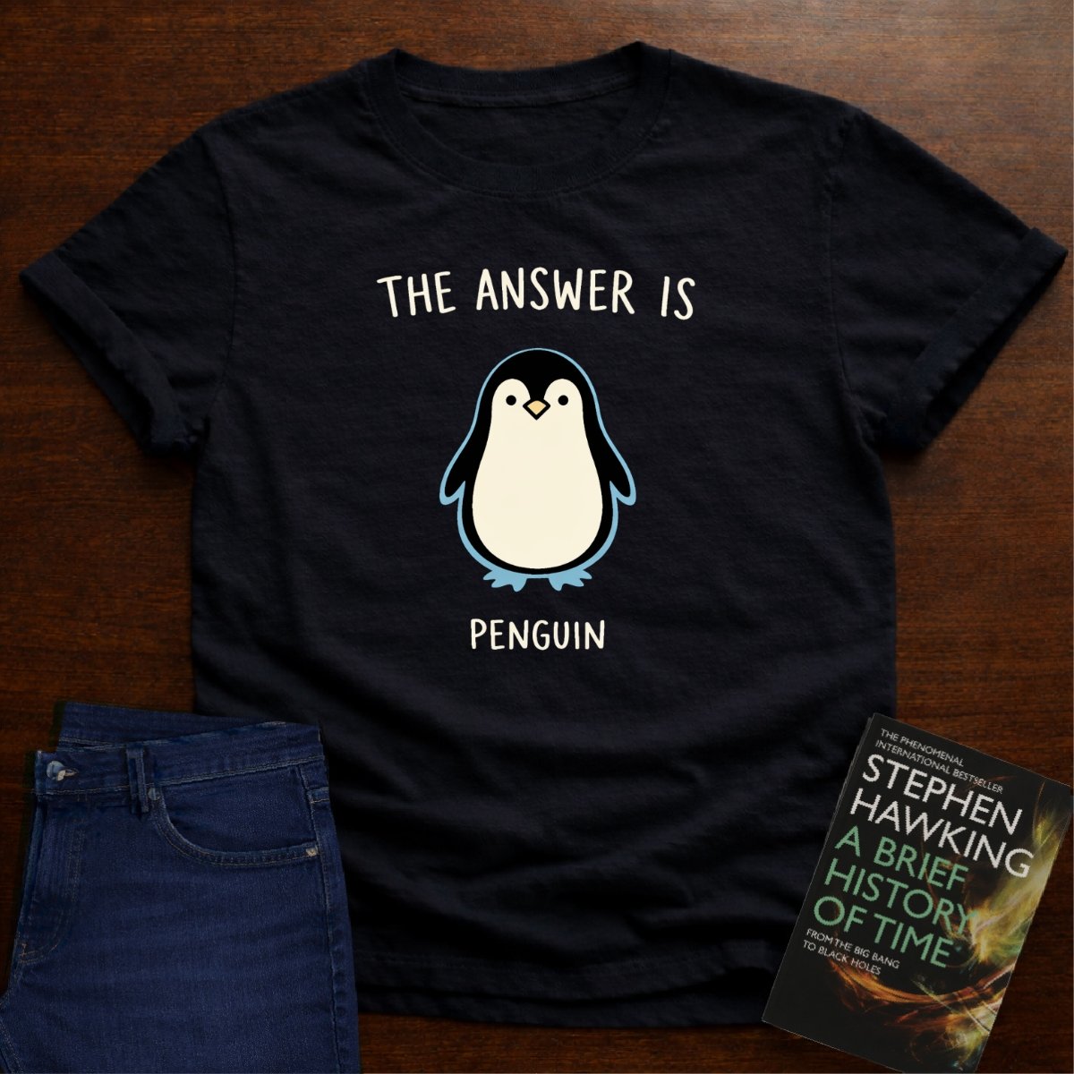 THE ANSWER IS PENGUIN. T-SHIRT – Black